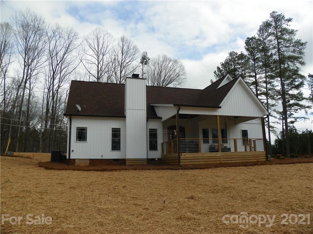 10617 Fink Road Mount Pleasant, NC 28124 - Photo 9 of 45 a house view with a garden space