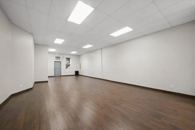 a view of a livingroom with wooden floor