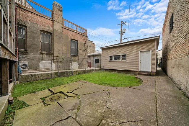 a front view of a building with parking