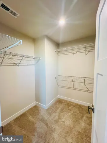 a view of a room with racks on the wall