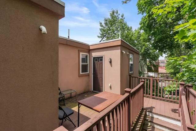 a view of a house with backyard and deck
