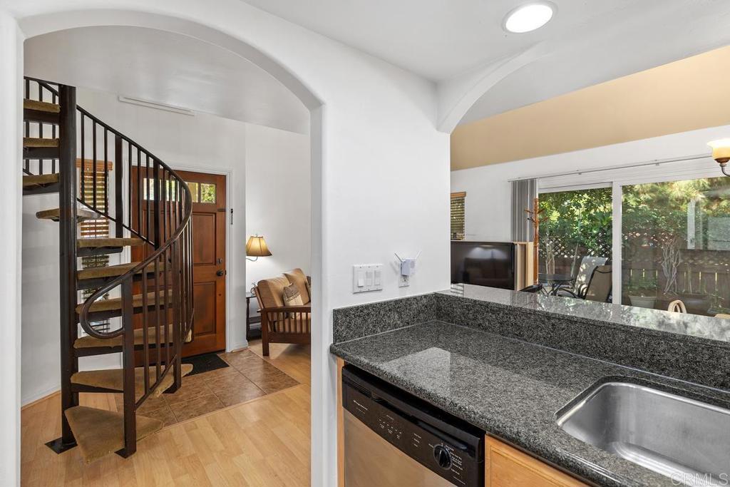 1145 Helix Street, Unit 1 Spring Valley, CA 91977 - Photo 13 of 30 a kitchen with a sink and a refrigerator