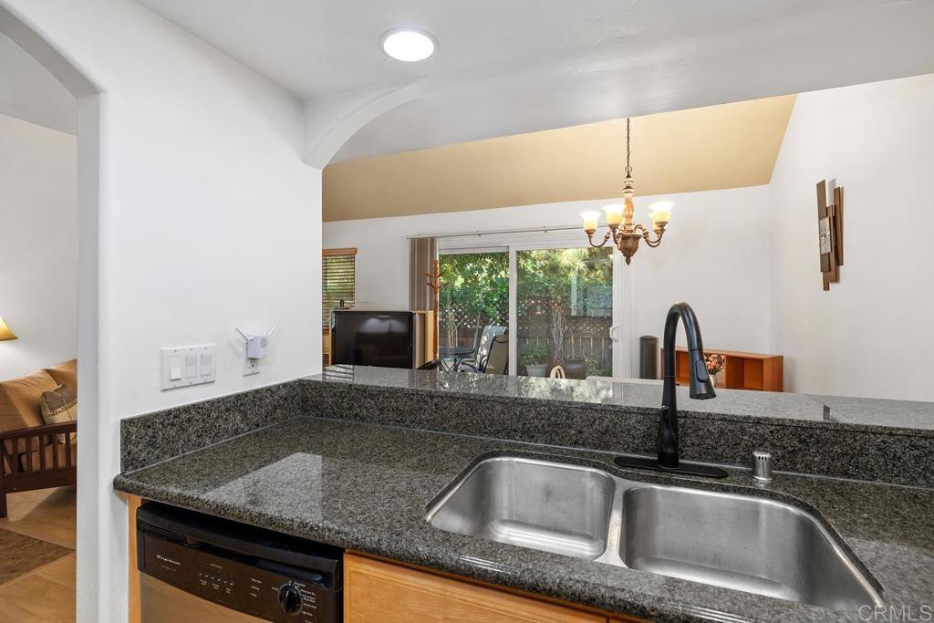 1145 Helix Street, Unit 1 Spring Valley, CA 91977 - Photo 14 of 30 a kitchen with a sink and a refrigerator