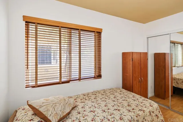 a view of a bedroom with a large window