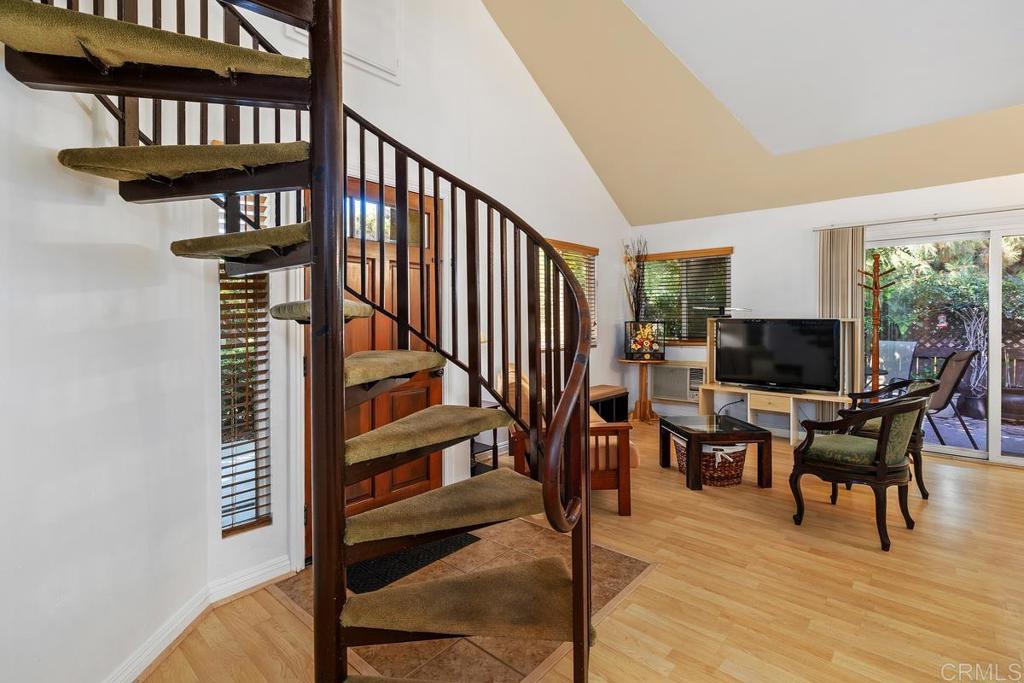 1145 Helix Street, Unit 1 Spring Valley, CA 91977 - Photo 25 of 30 a view of a livingroom with furniture and staircase