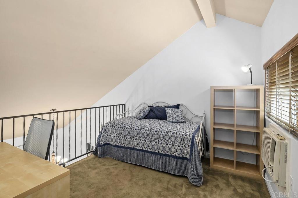 1145 Helix Street, Unit 1 Spring Valley, CA 91977 - Photo 26 of 30 a bedroom with a bed and a window