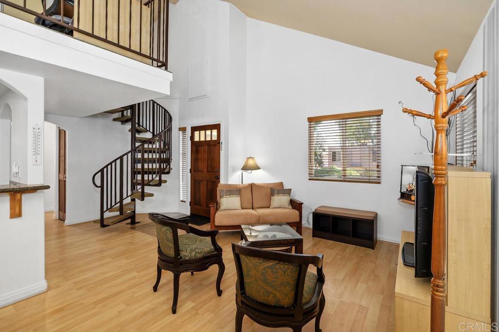 1145 Helix Street, Unit 1 Spring Valley, CA 91977 - Photo 6 of 30 a dining room with furniture a fireplace and wooden floor