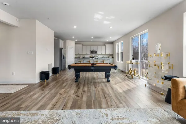 a living room with a couch and a wooden floor
