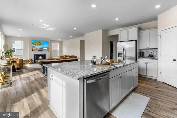 a kitchen with stainless steel appliances granite countertop a lot of counter top space