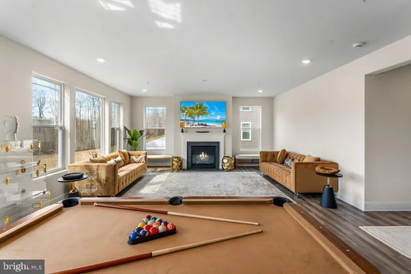 a living room with furniture fireplace and window