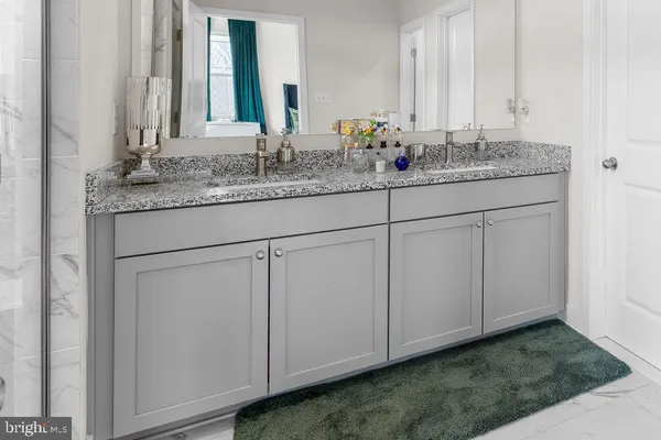 a bathroom with a sink and mirror