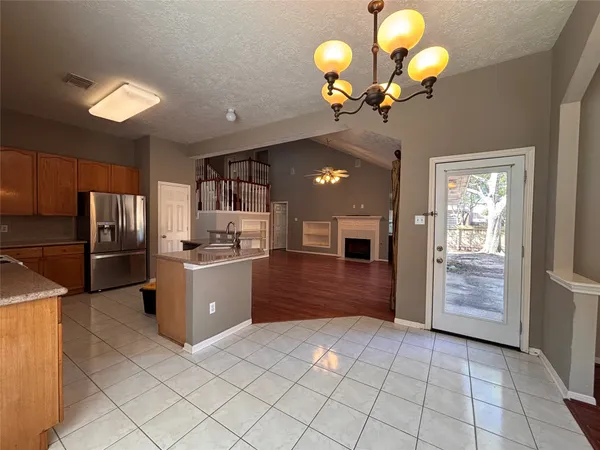 a kitchen with a cabinets and stainless steel appliances