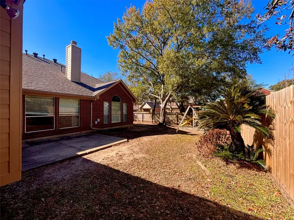 a view of house with yard