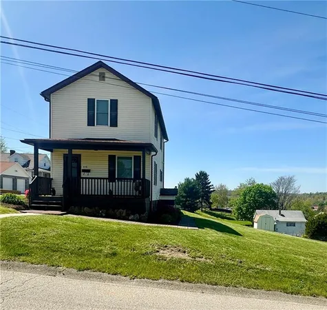 a view of a house with a yard