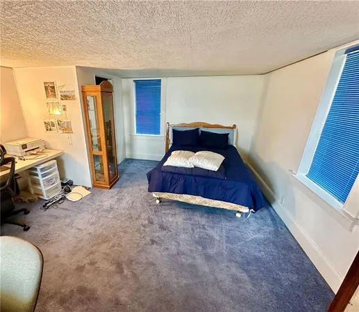 a room with furniture and a wooden floor