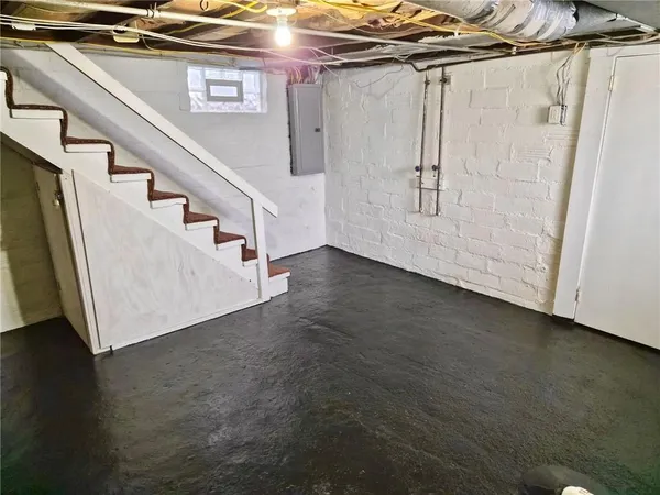 a view of a room with wooden floor