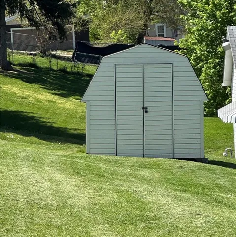 a backyard of a house with lots of green space