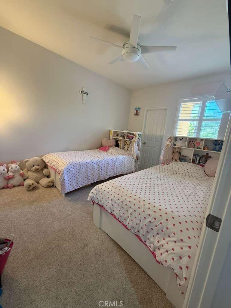 2931 Esperanza Way, Unit B Simi Valley, CA 93063 - Photo 38 of 49 a bedroom with two beds and window