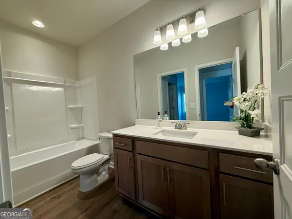 a view of a chair and table in backyard