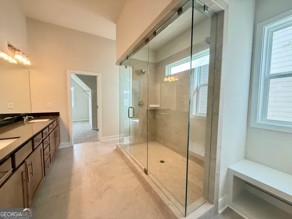 a view of a table and chairs in the garden