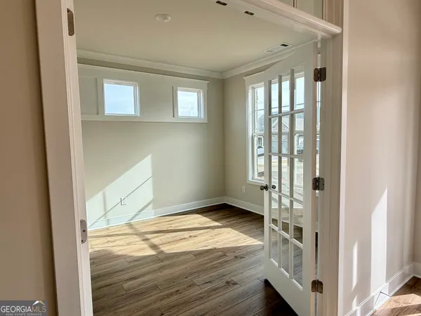 a kitchen that has a lot of cabinets a sink and appliances in it