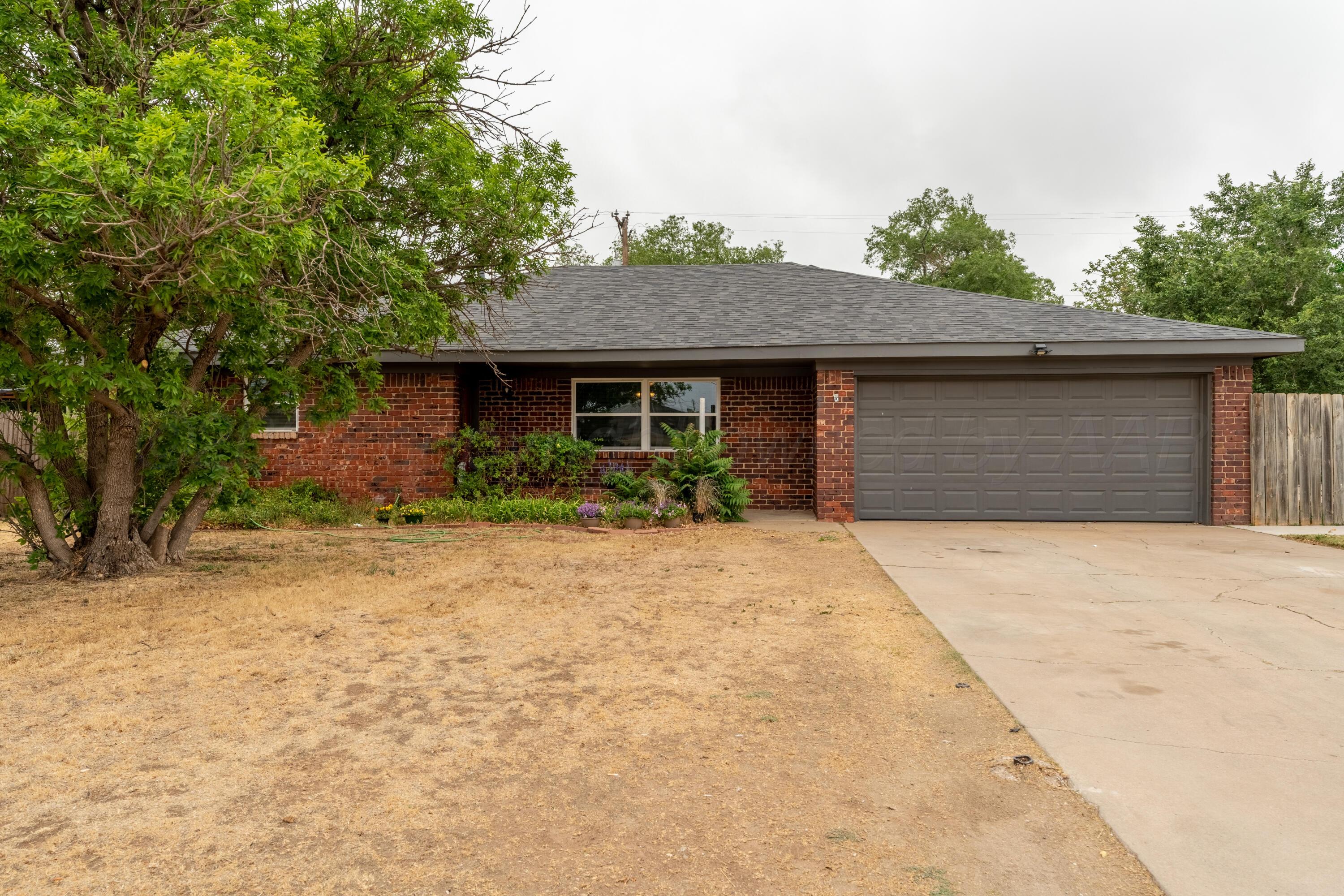 4836 Hillside Road Amarillo, TX 79109 - Photo 1 of 28 a front view of house with yard