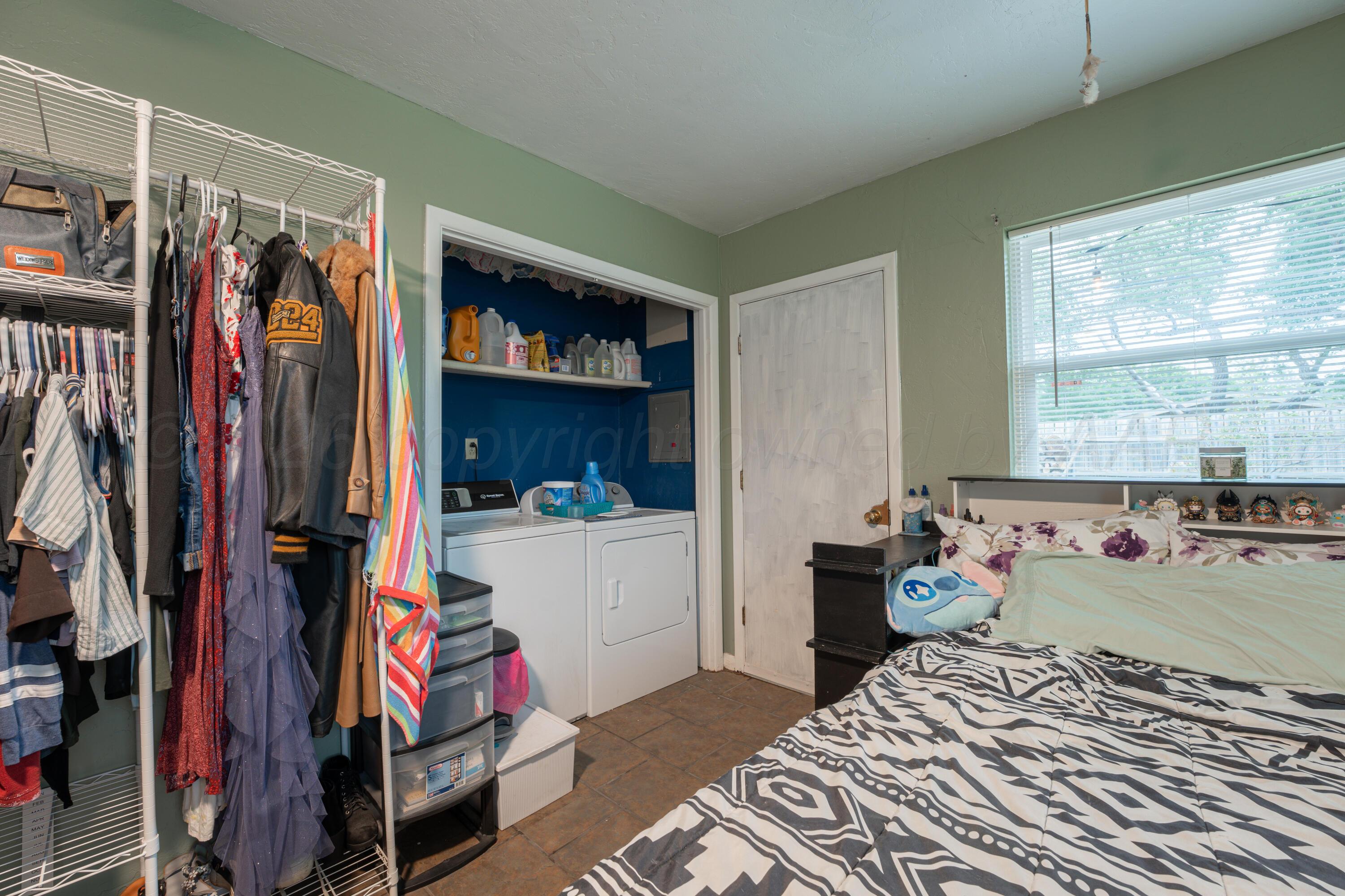 4836 Hillside Road Amarillo, TX 79109 - Photo 13 of 28 a bed room with a bed and a window