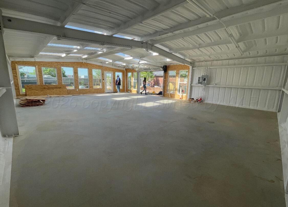 4836 Hillside Road Amarillo, TX 79109 - Photo 27 of 28 a view of an empty room with a fireplace