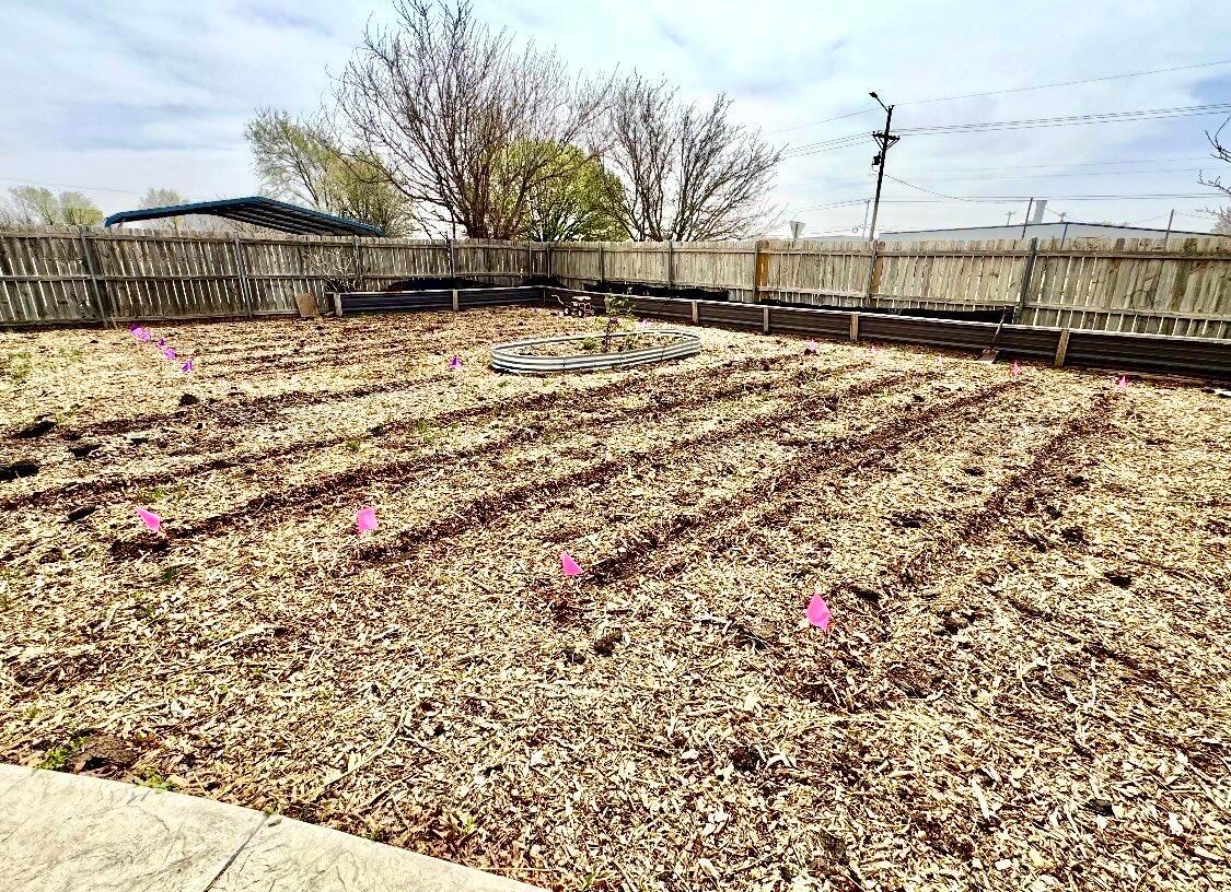 4836 Hillside Road Amarillo, TX 79109 - Photo 28 of 28 a street view with wooden fence