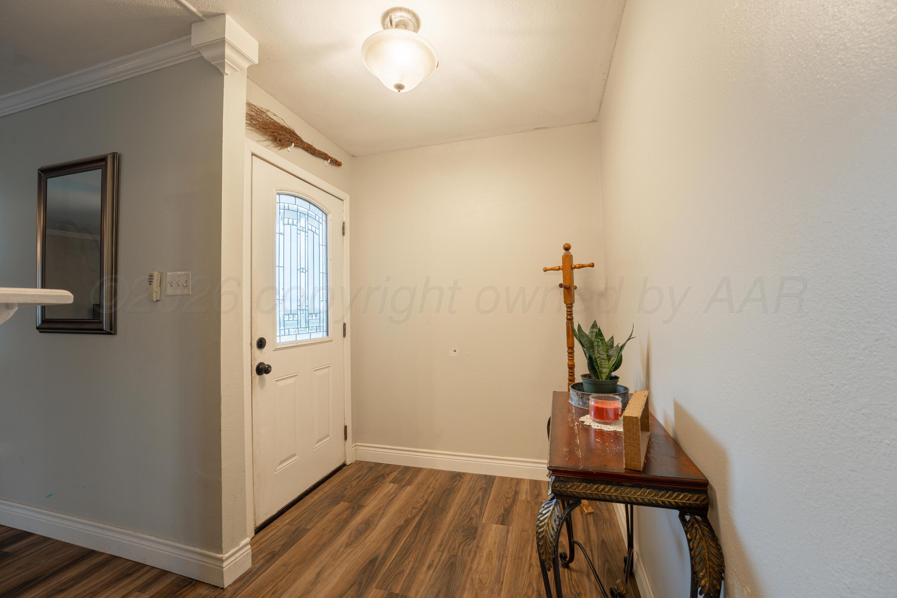 4836 Hillside Road Amarillo, TX 79109 - Photo 3 of 28 a view of an entryway with wooden floor