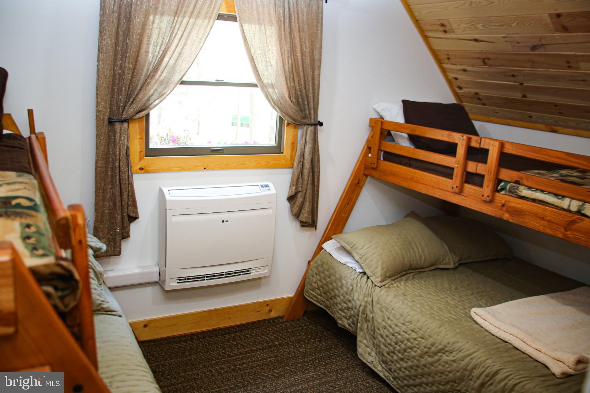 120 Rock Lodge Road McHenry, MD 21541 - Photo 11 of 23 a bedroom with a bed and a window