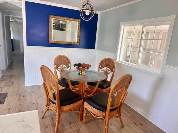 a dining room with furniture and window