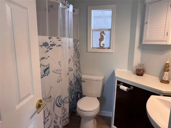 a bathroom with a toilet and a sink