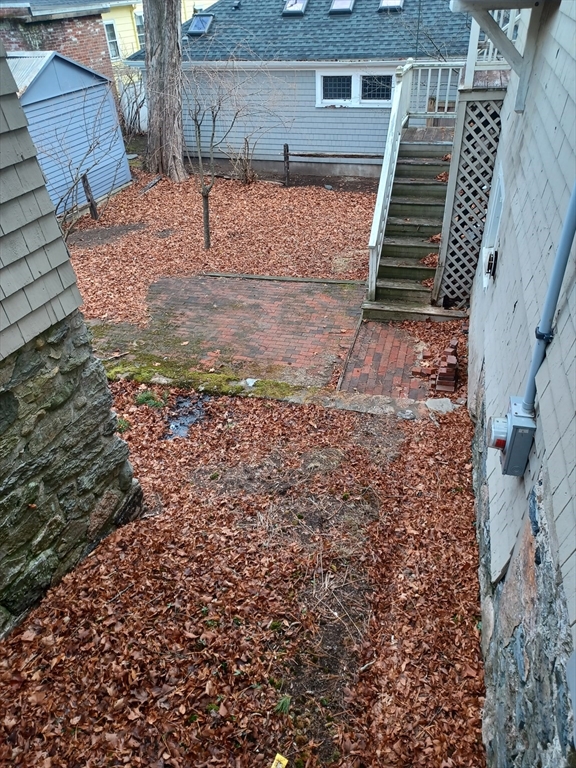 12 Oakwood Road Newton, MA 02466 - Photo 2 of 5 a view of a backyard with wooden fence