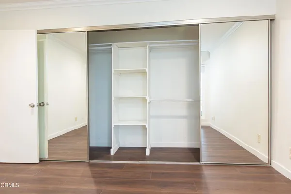 a view of an empty walk in closet