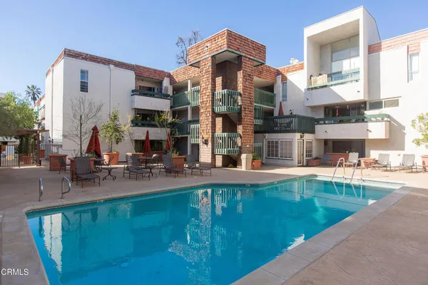 a view of pool with outdoor seating