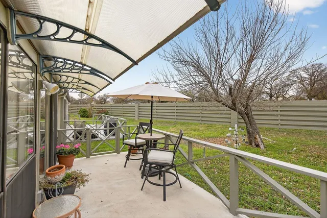 a view of sitting area with furniture and backyard