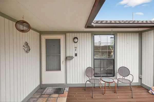 a view of room with furniture and wooden floor