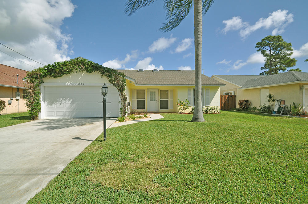 6229 Ungerer Street Jupiter, FL 33458 - Photo 1 of 28 Front Exterior View