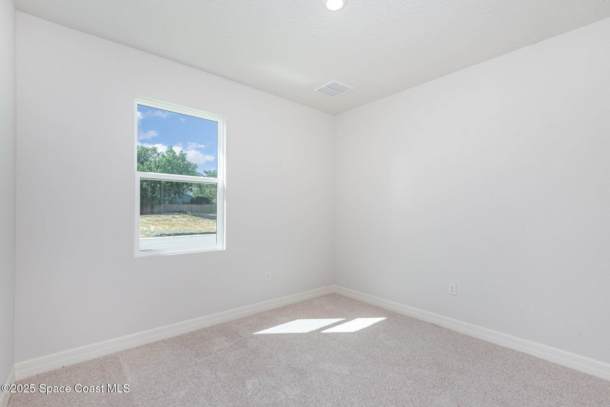230 1st Street Cocoa, FL 32922 - Photo 14 of 34 a view of an empty room with a window