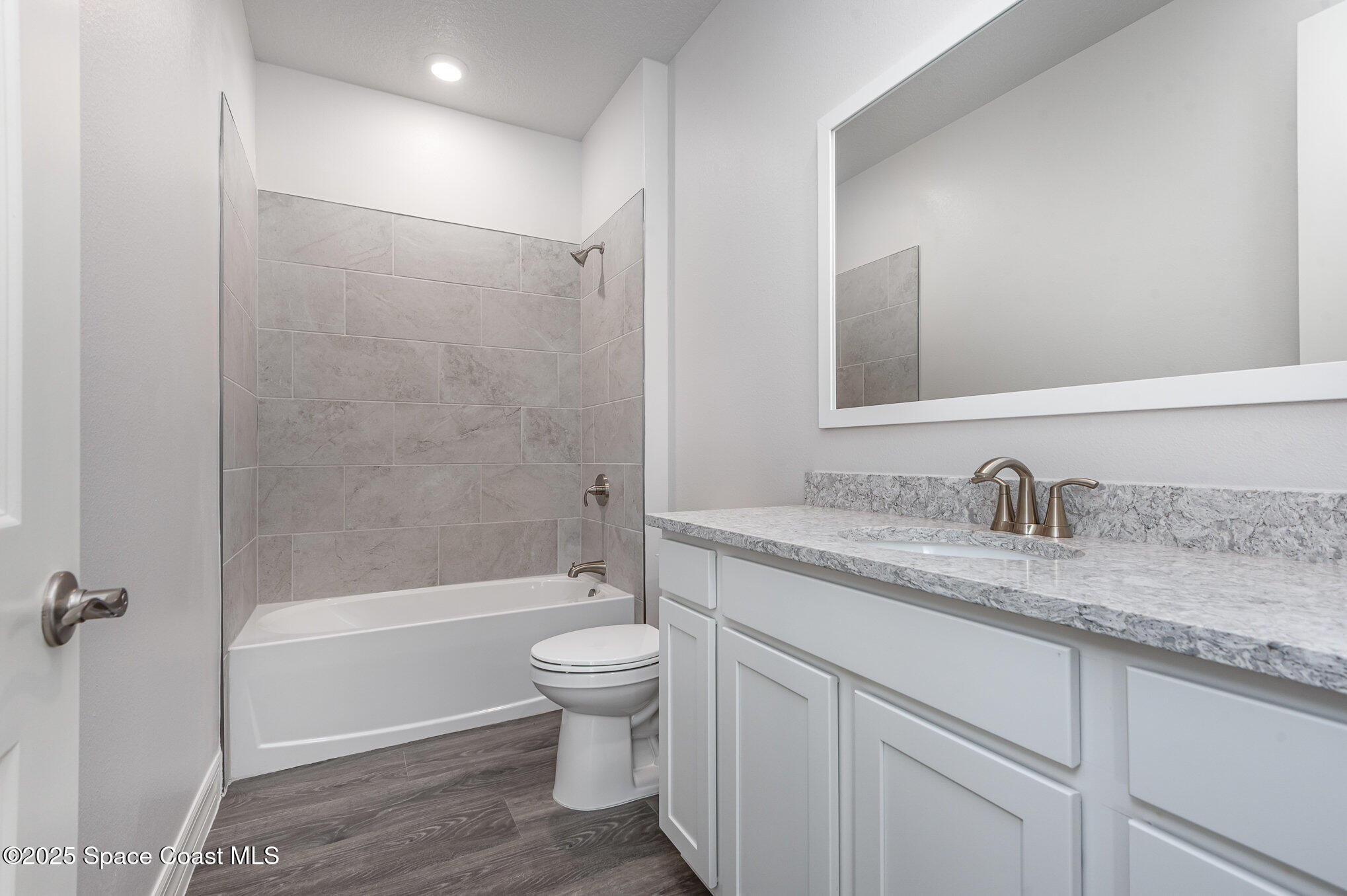 230 1st Street Cocoa, FL 32922 - Photo 16 of 34 a bathroom with a granite countertop sink toilet and shower
