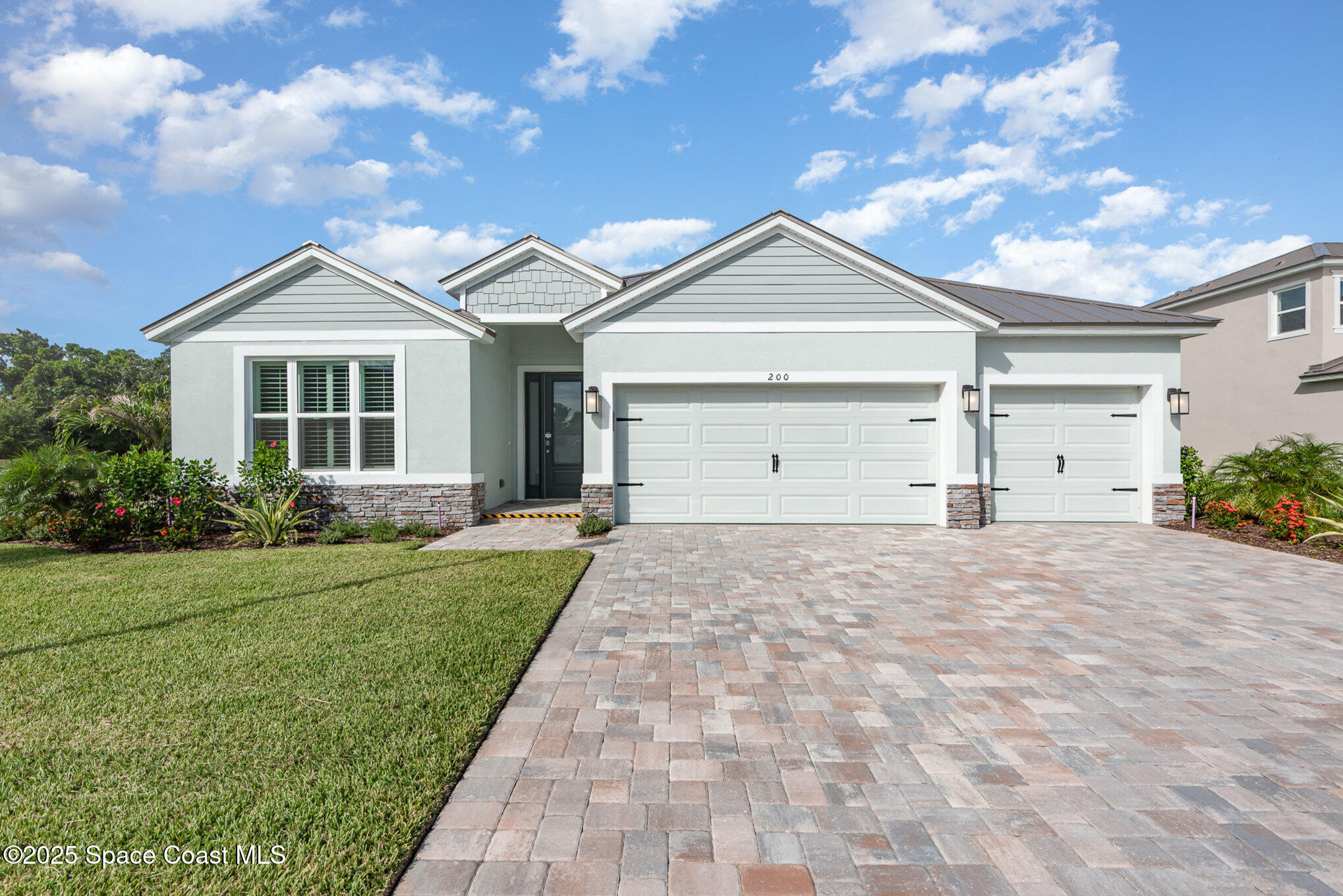 230 1st Street Cocoa, FL 32922 - Photo 2 of 34 a view of a house with a yard and garage