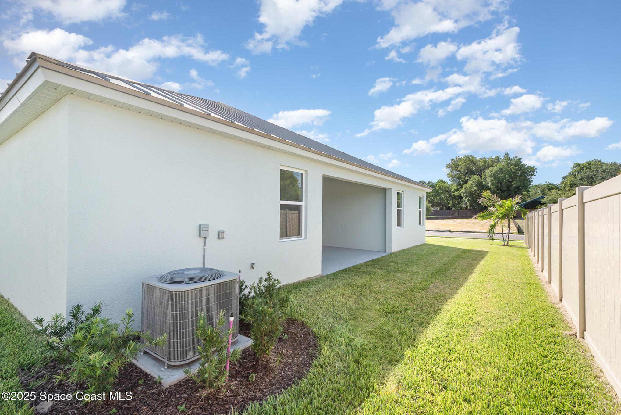 230 1st Street Cocoa, FL 32922 - Photo 23 of 34 a view of a backyard with plants and a patio