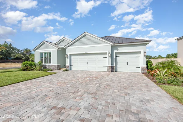 a view of house with yard and entertaining space