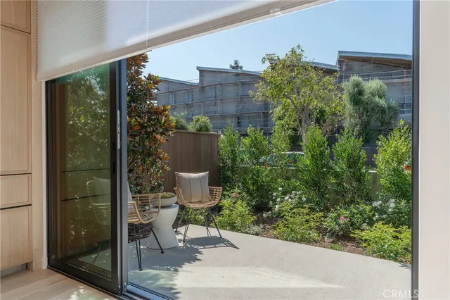a kitchen with stainless steel appliances granite countertop a sink a stove and a wooden floors