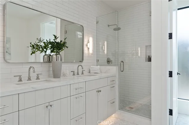 a view of a hallway with wooden floor and entryway