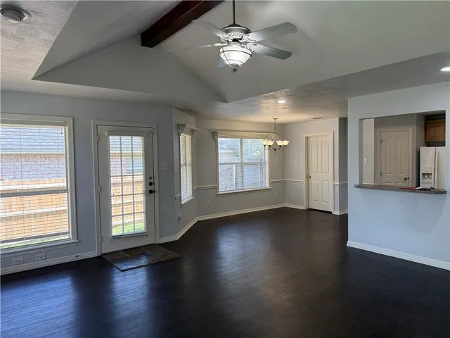 a kitchen with granite countertop white cabinets stainless steel appliances and sink