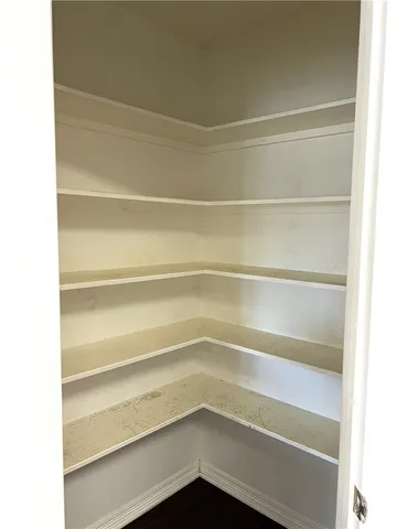 a storage room with a wooden floor