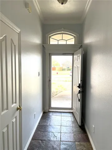 a view of an entryway with a door