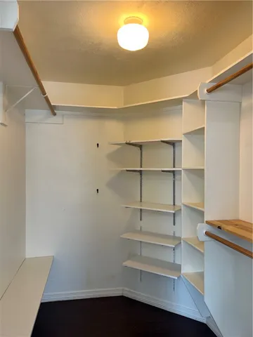 a storage room with wooden floor